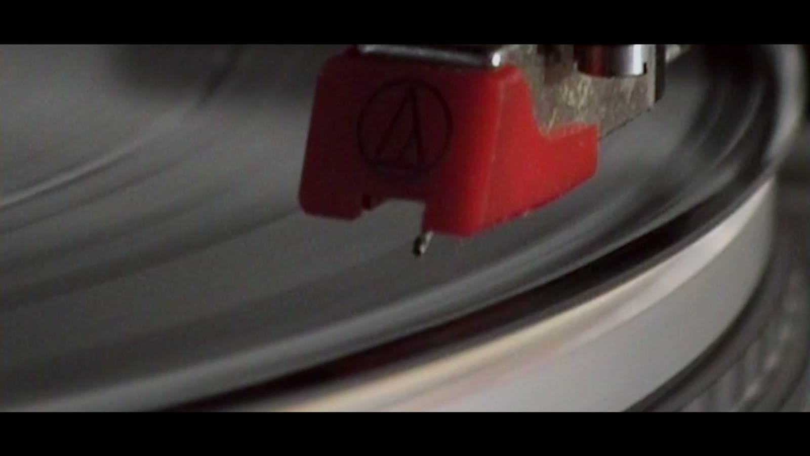 Still from Brothers Adelekan: a needle on a turntable, at home