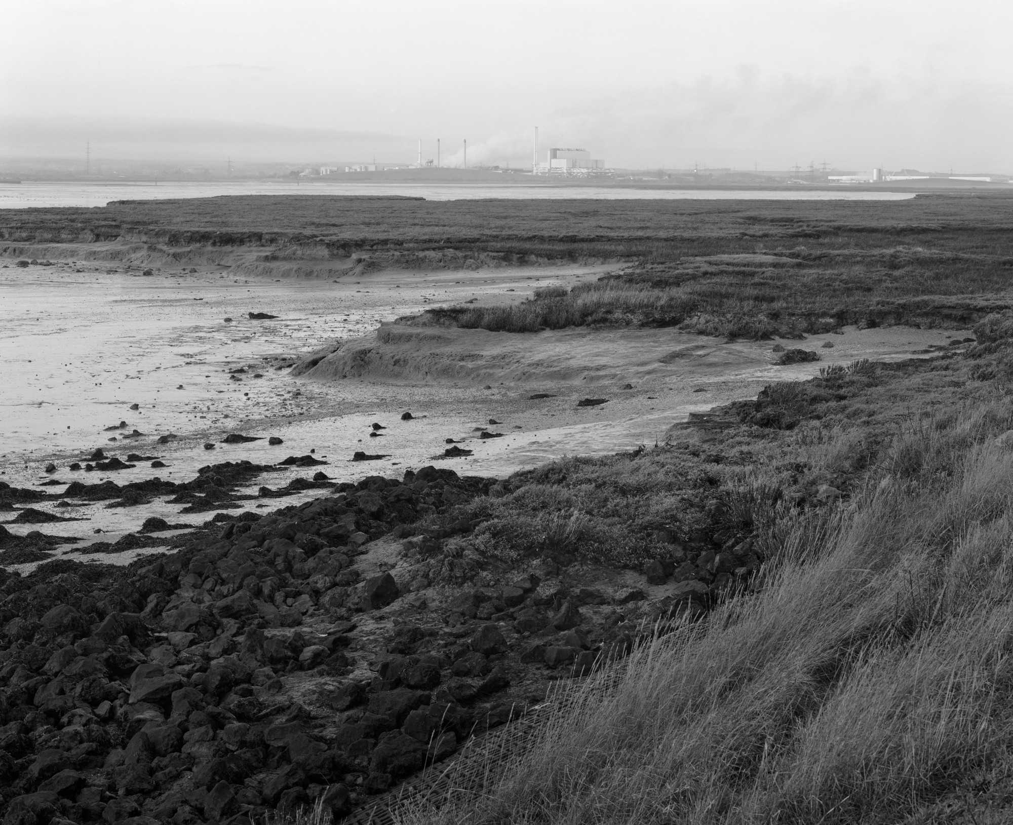 The flats meeting the estuary, industry beyond
