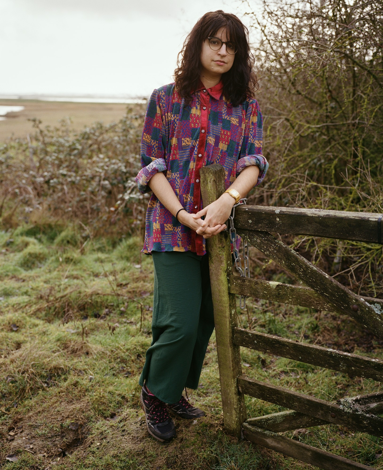A writer at a gate on the marsh