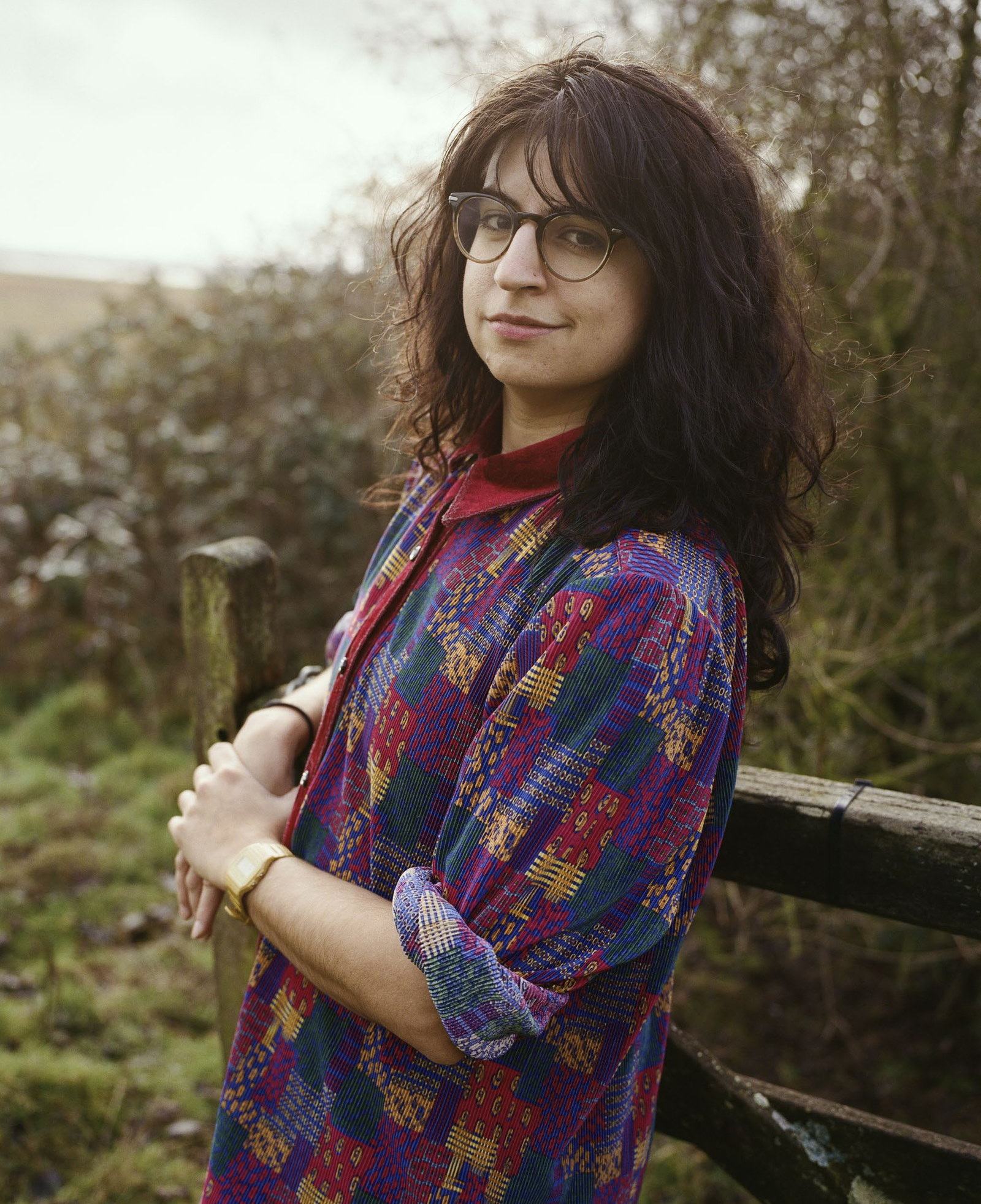 A writer at a field gate on the marsh