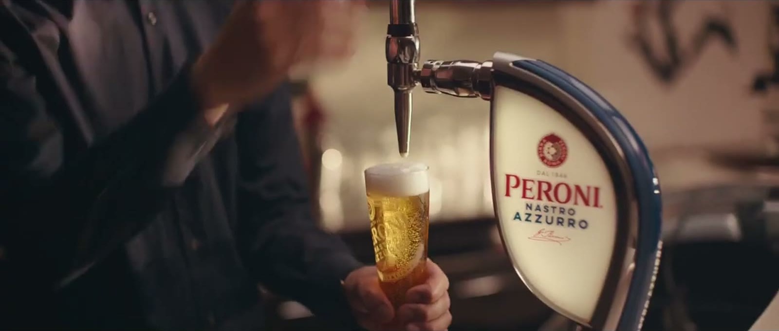 Still from La Passeggiata: a Peroni poured from the tap