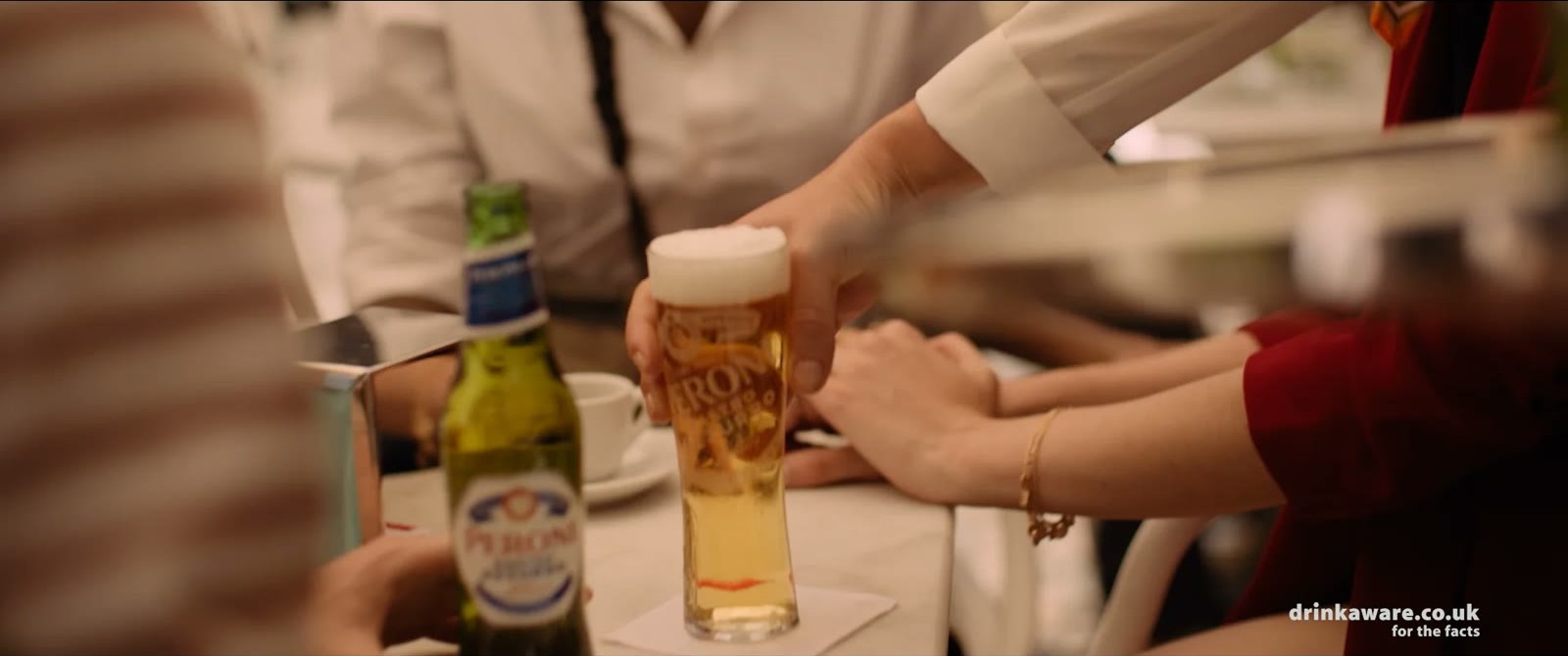 Still from La Passeggiata: glasses and a bottle on a table